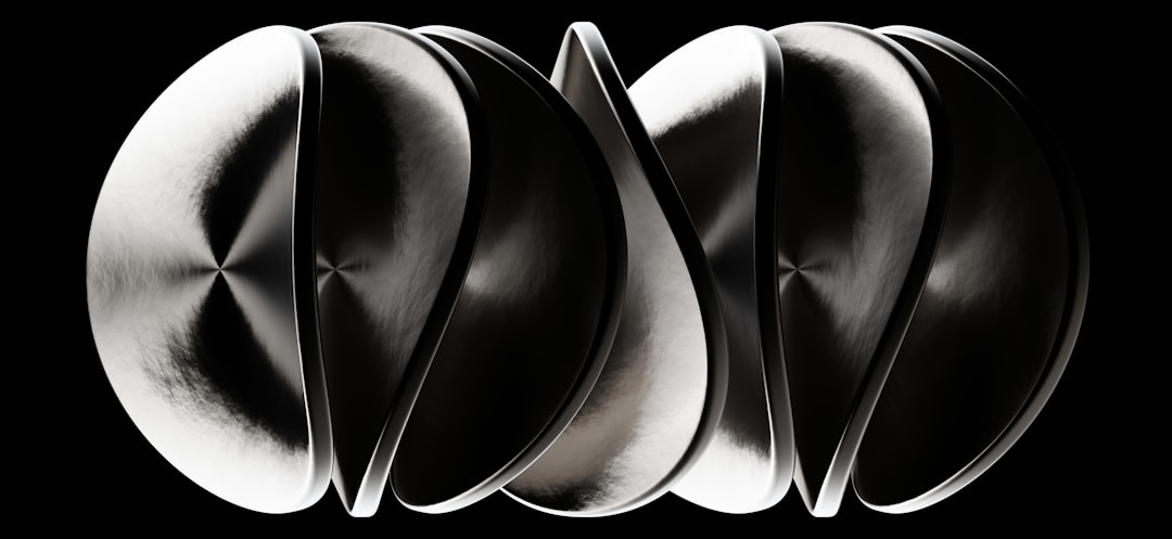 Abstract metallic twisted forms with reflective surfaces.